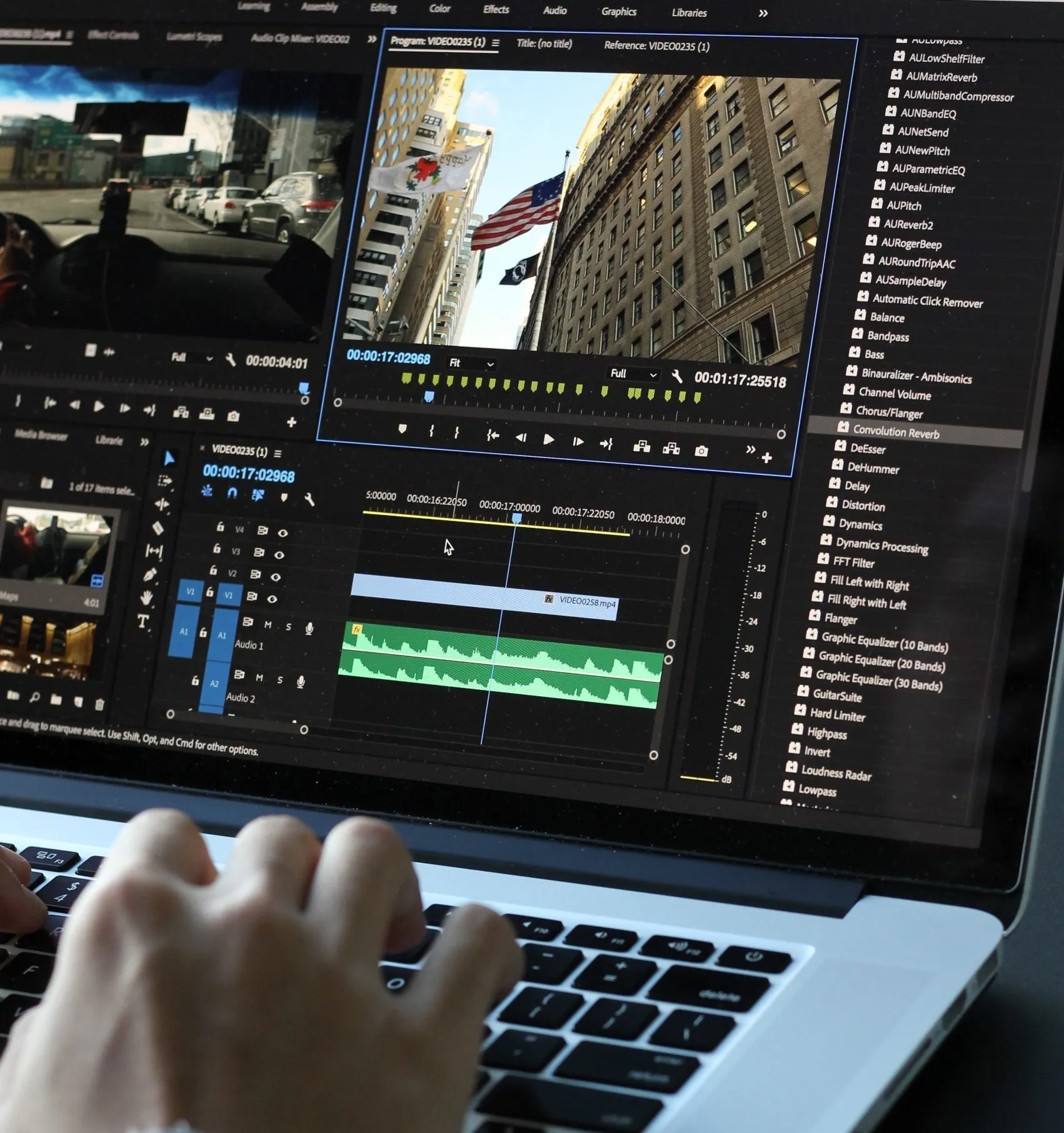 Someone editing a video on their laptop using video editing software
