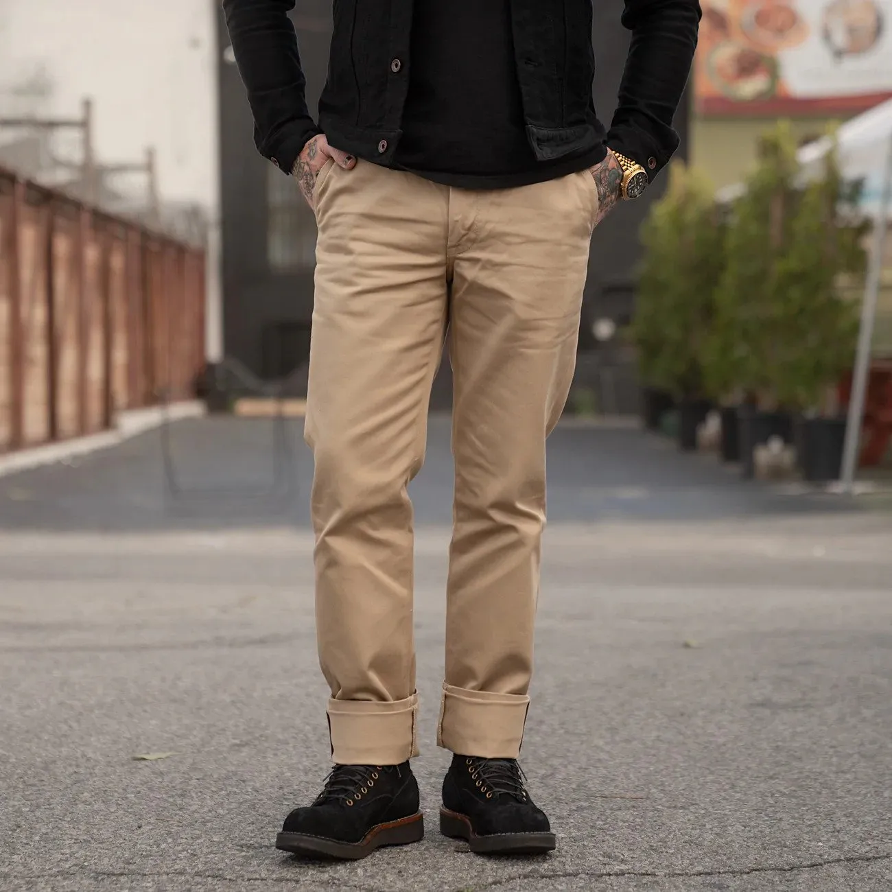Man wearing khaki Snake Oil Provisions trousers