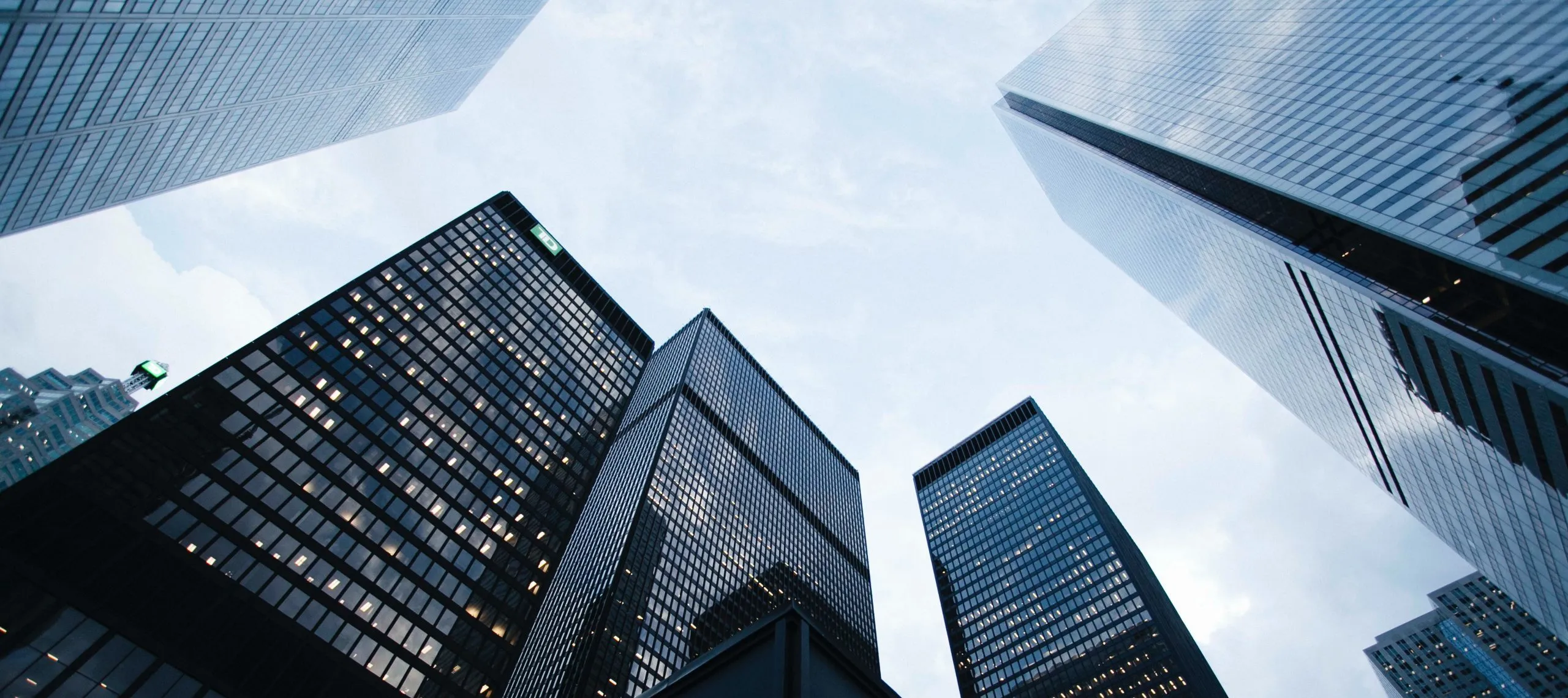 View of tall skyscrapers from the ground looking up at the sky