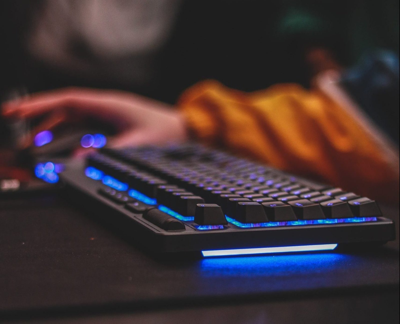 light shining through a keyboard that's sitting on a desk