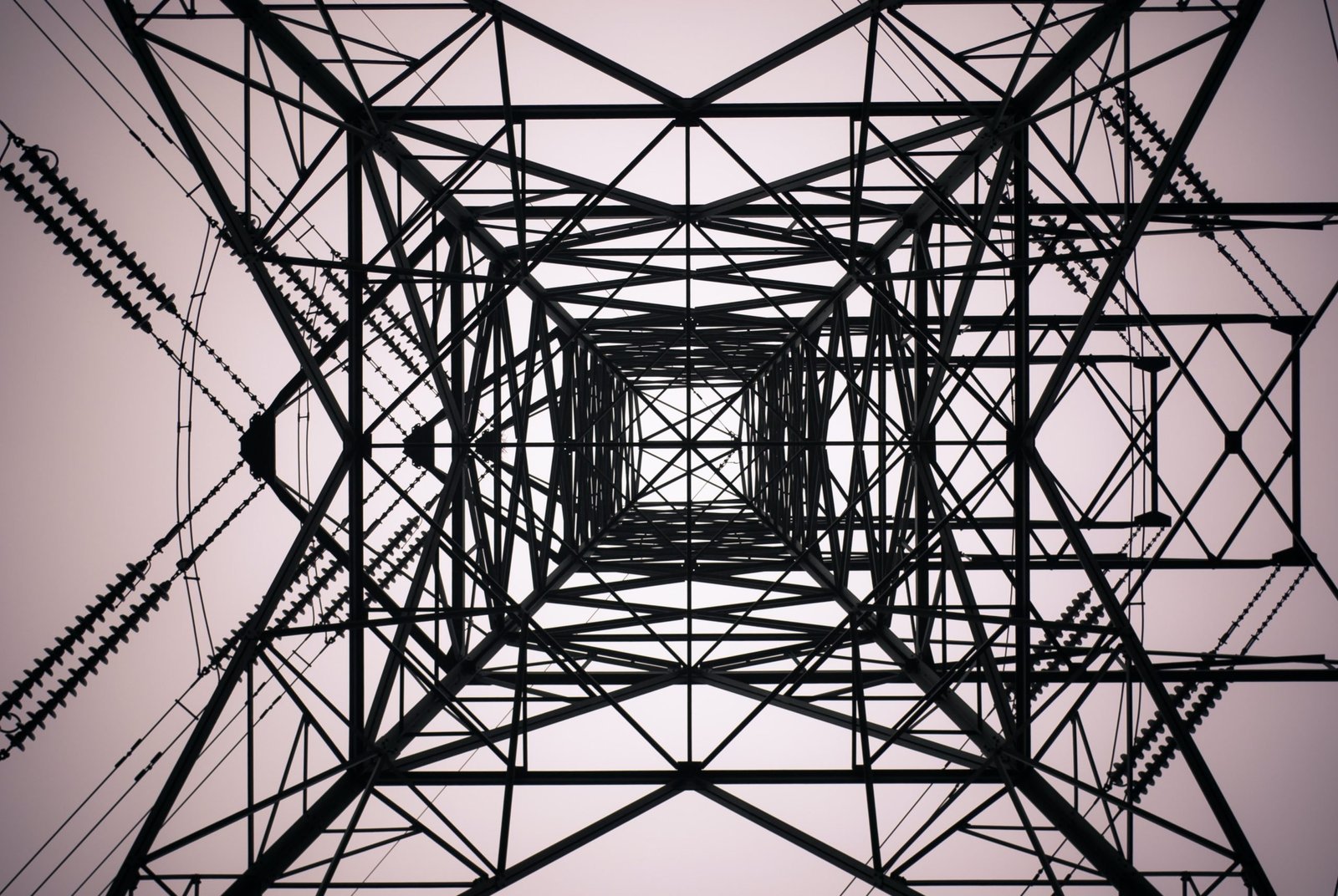 looking up from the bottom of a tall metal tower