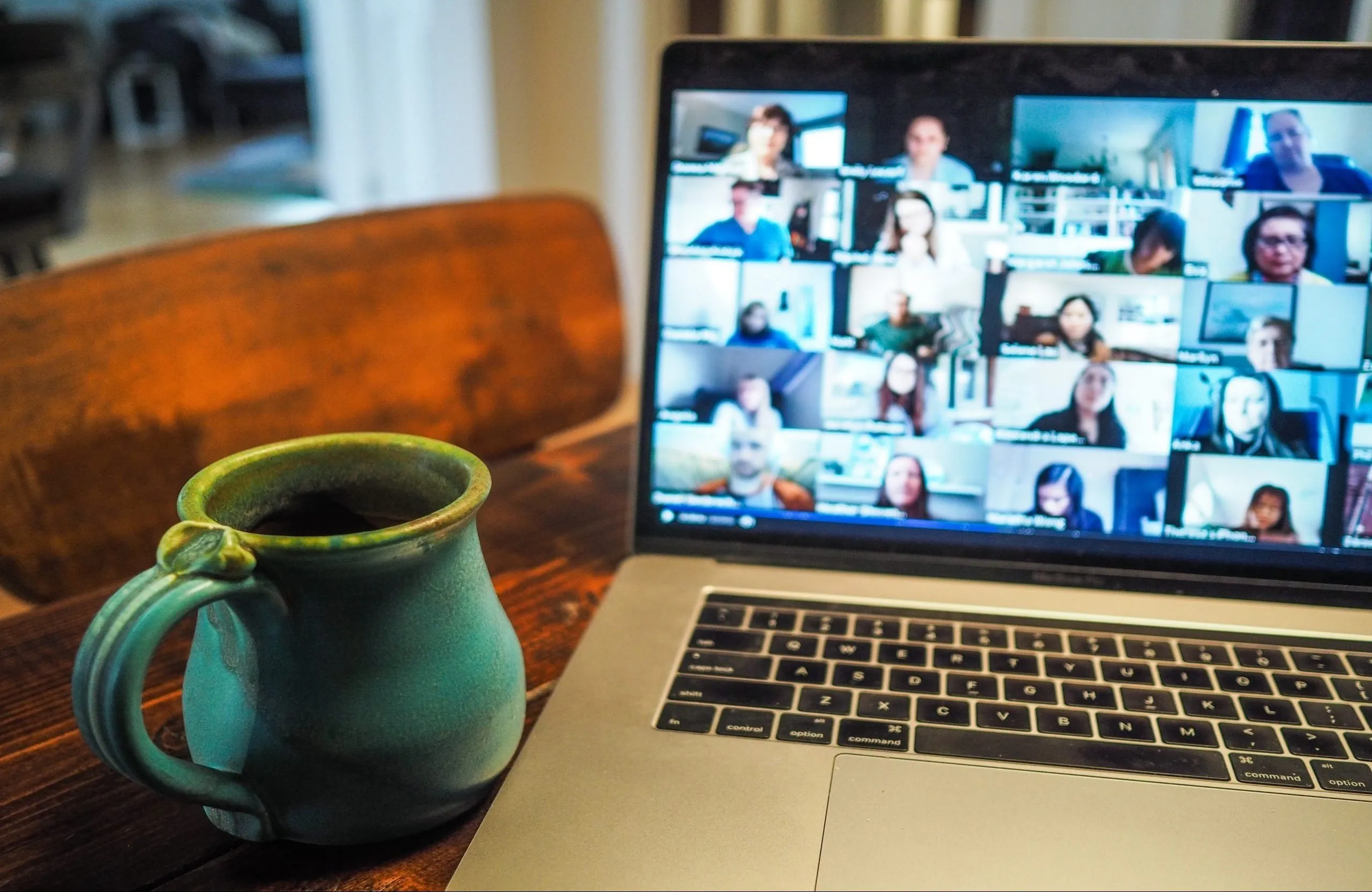 laptop showing a virtual zoom meeting room