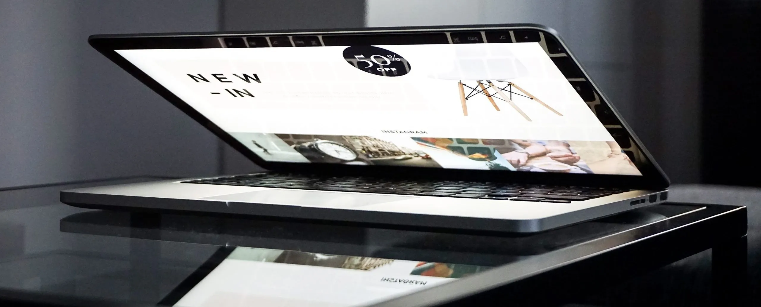 laptop almost closed and showing online store
