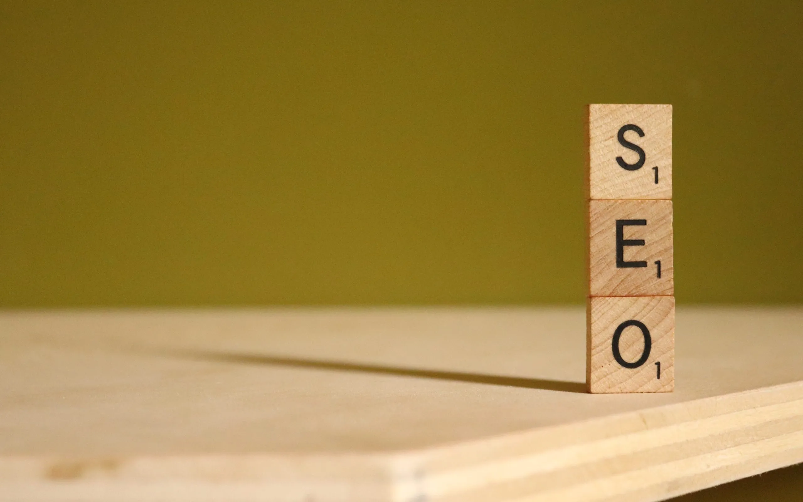 scrabble letters spelling 'seo' stacked on top of each other