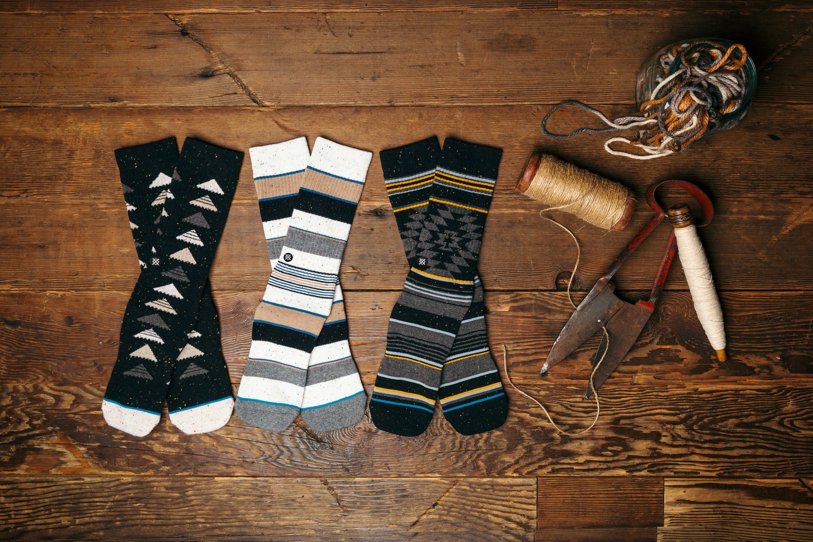 futurestitch stance socks displayed next to sewing supplies